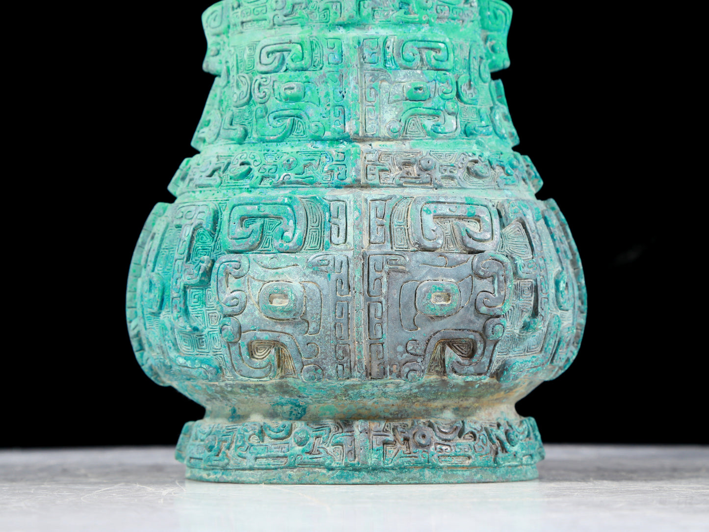 A precious bronze animal mask bottle with lid