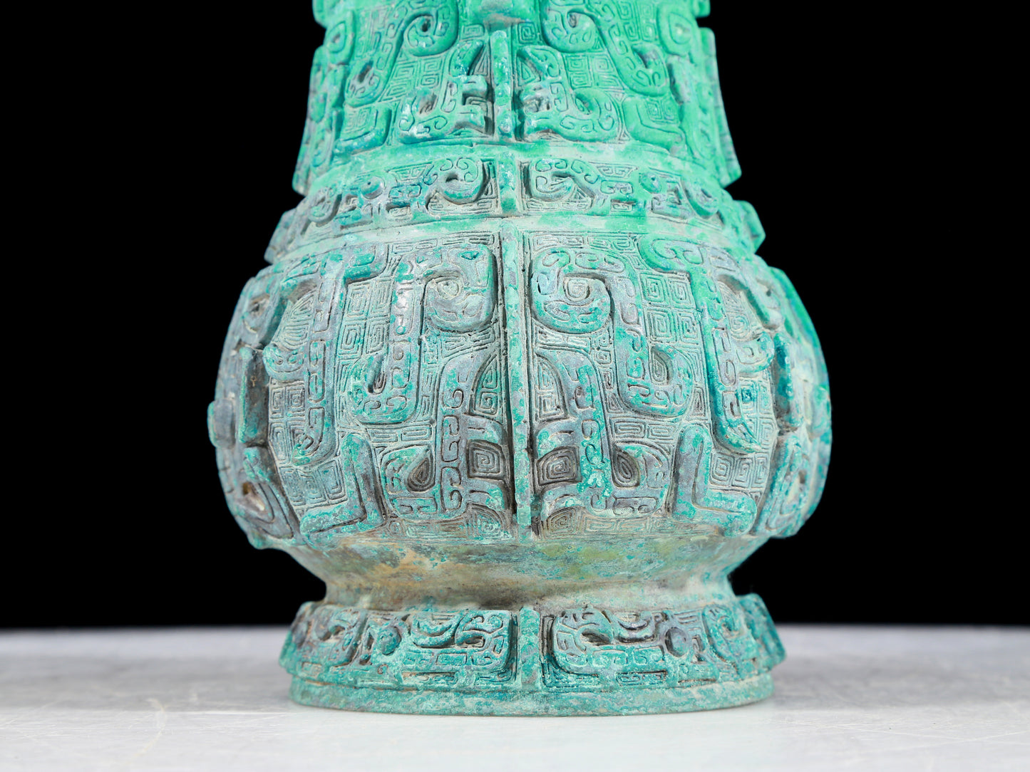 A precious bronze animal mask bottle with lid