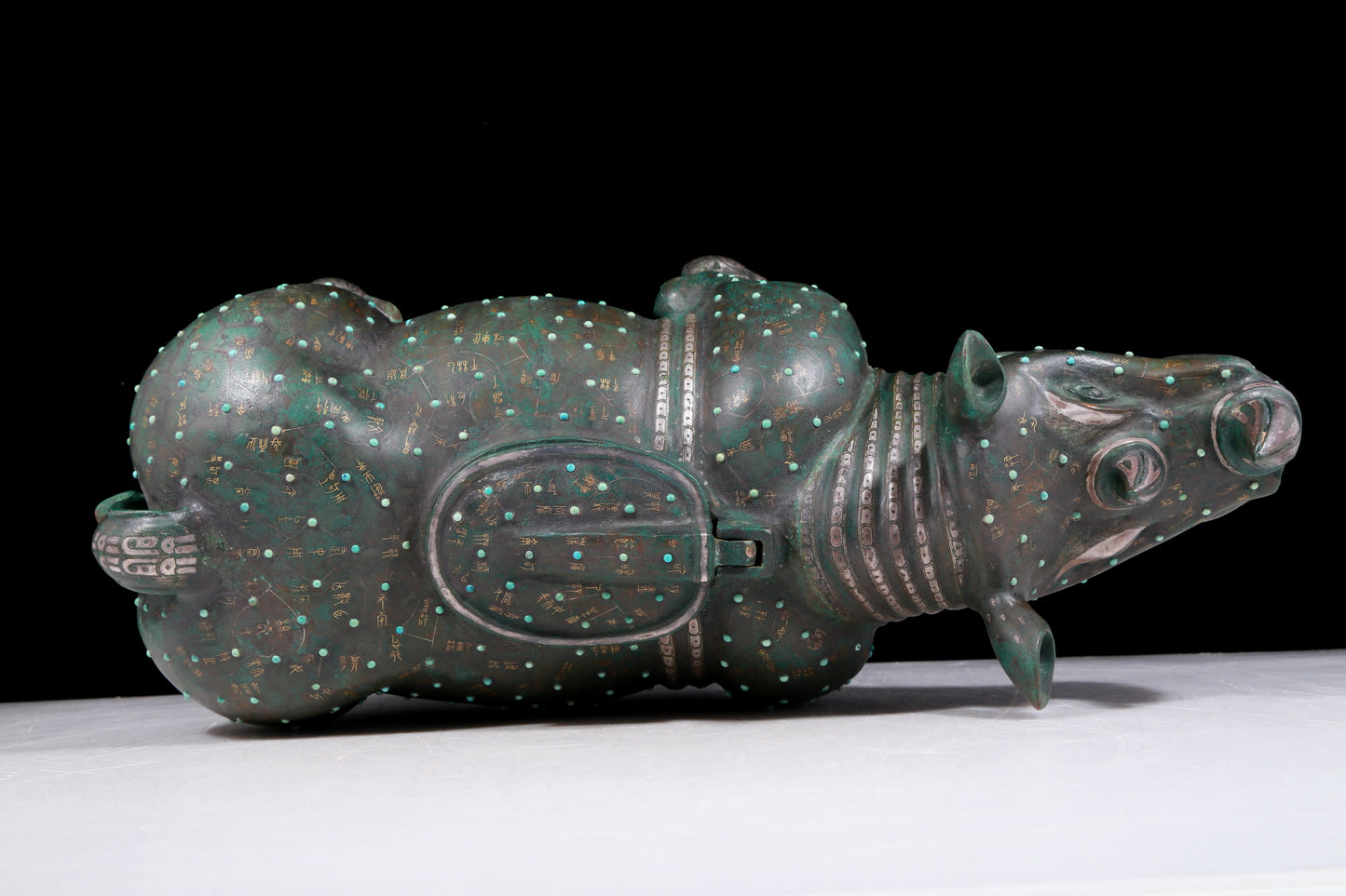 A precious bronze rhinoceros jar inlaid with gold and silver