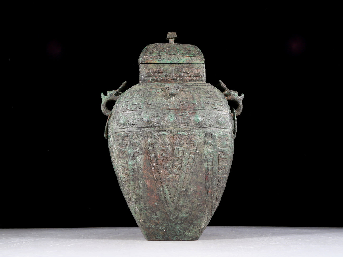 A rare bronze animal-faced amphora with lid