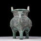 A precious bronze tripod pot with animal masks