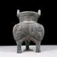 A precious bronze tripod pot with animal masks