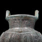 A precious bronze tripod pot with animal masks