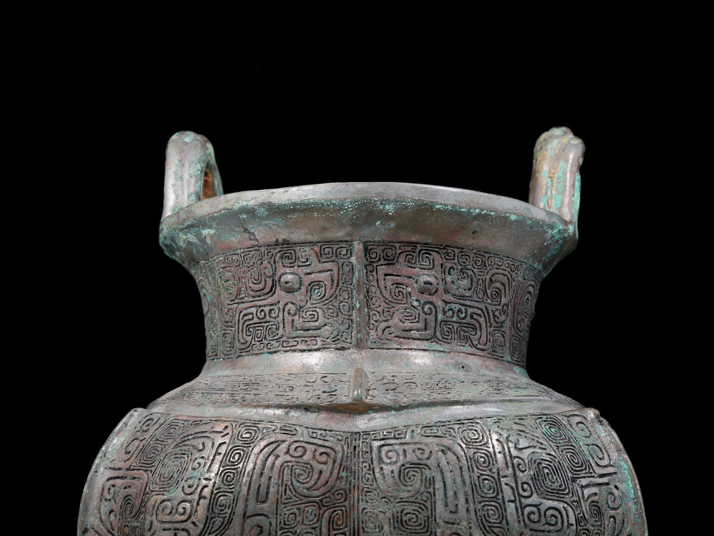 A precious bronze tripod pot with animal masks