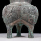 A precious bronze tripod pot with animal masks