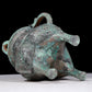 A precious bronze tripod pot with animal masks