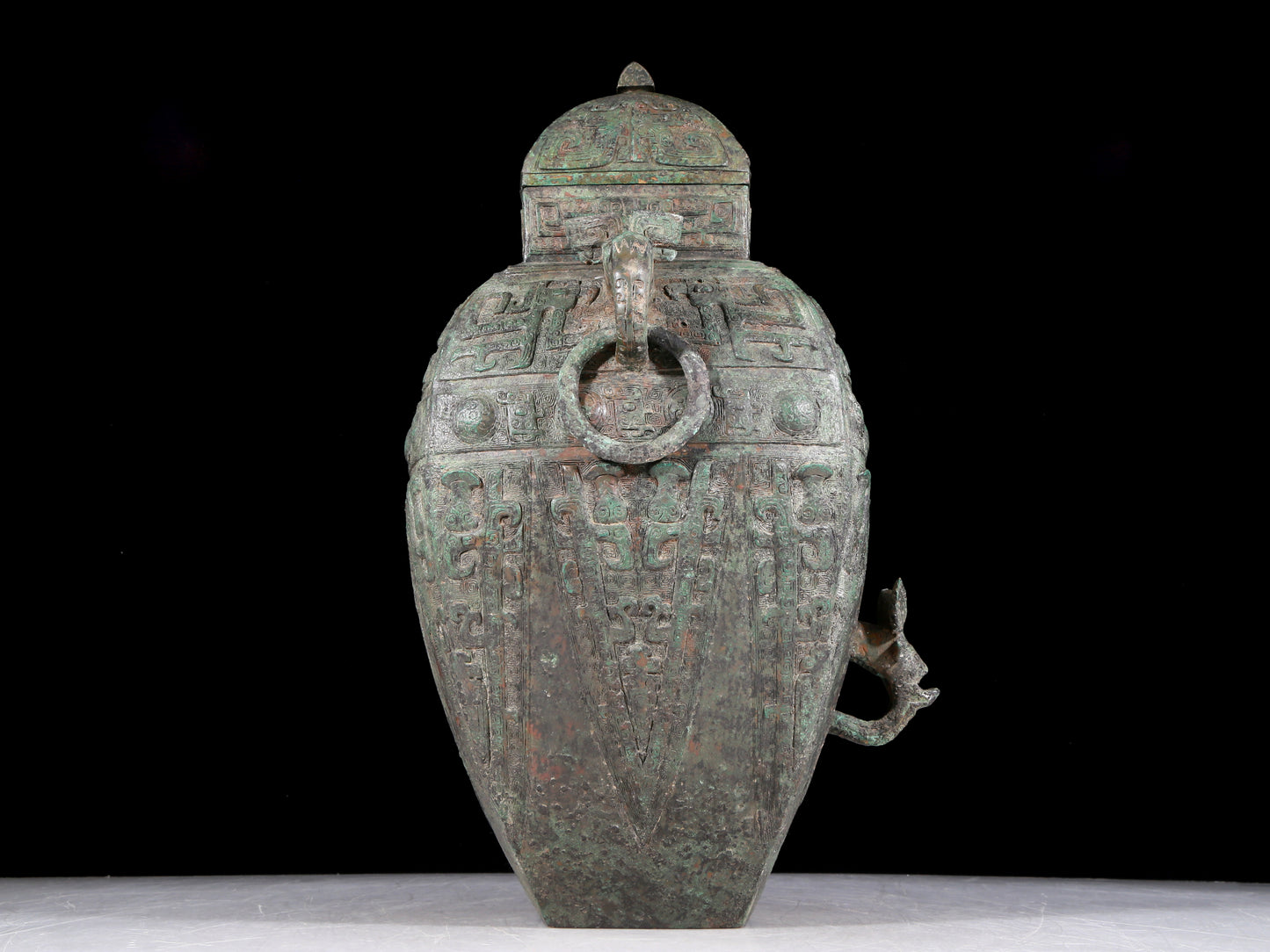 A rare bronze animal-faced amphora with lid