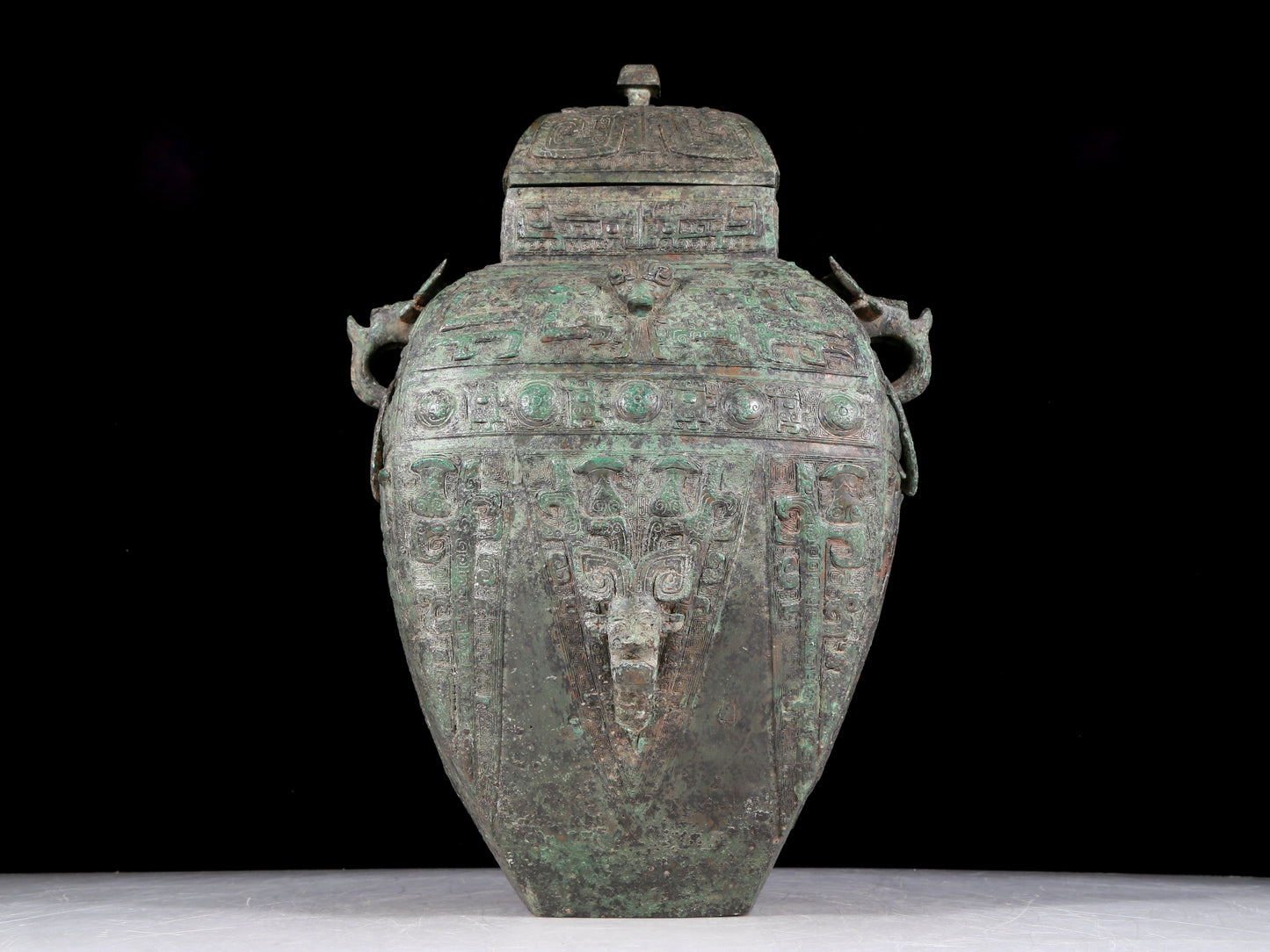 A rare bronze animal-faced amphora with lid