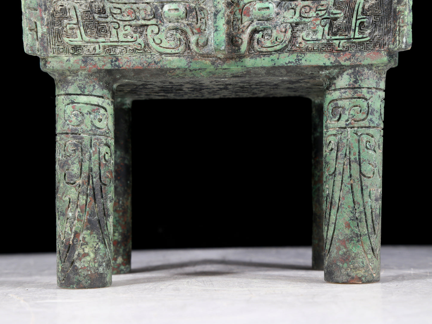 A precious bronze animal-faced tripod with two ears and four legs