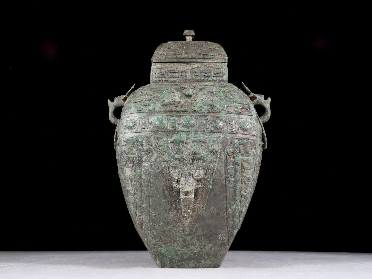 A rare bronze animal-faced amphora with lid