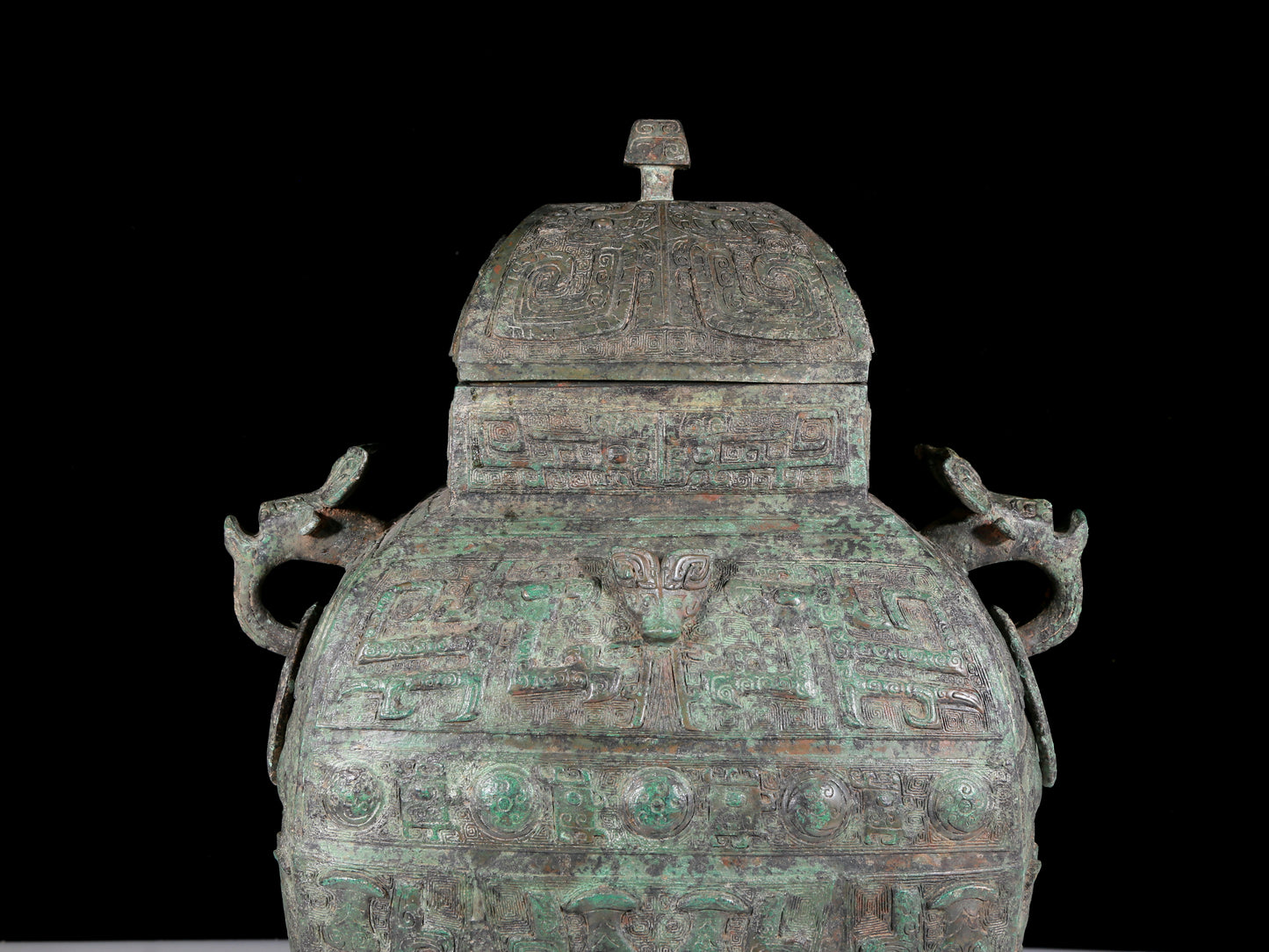 A rare bronze animal-faced amphora with lid