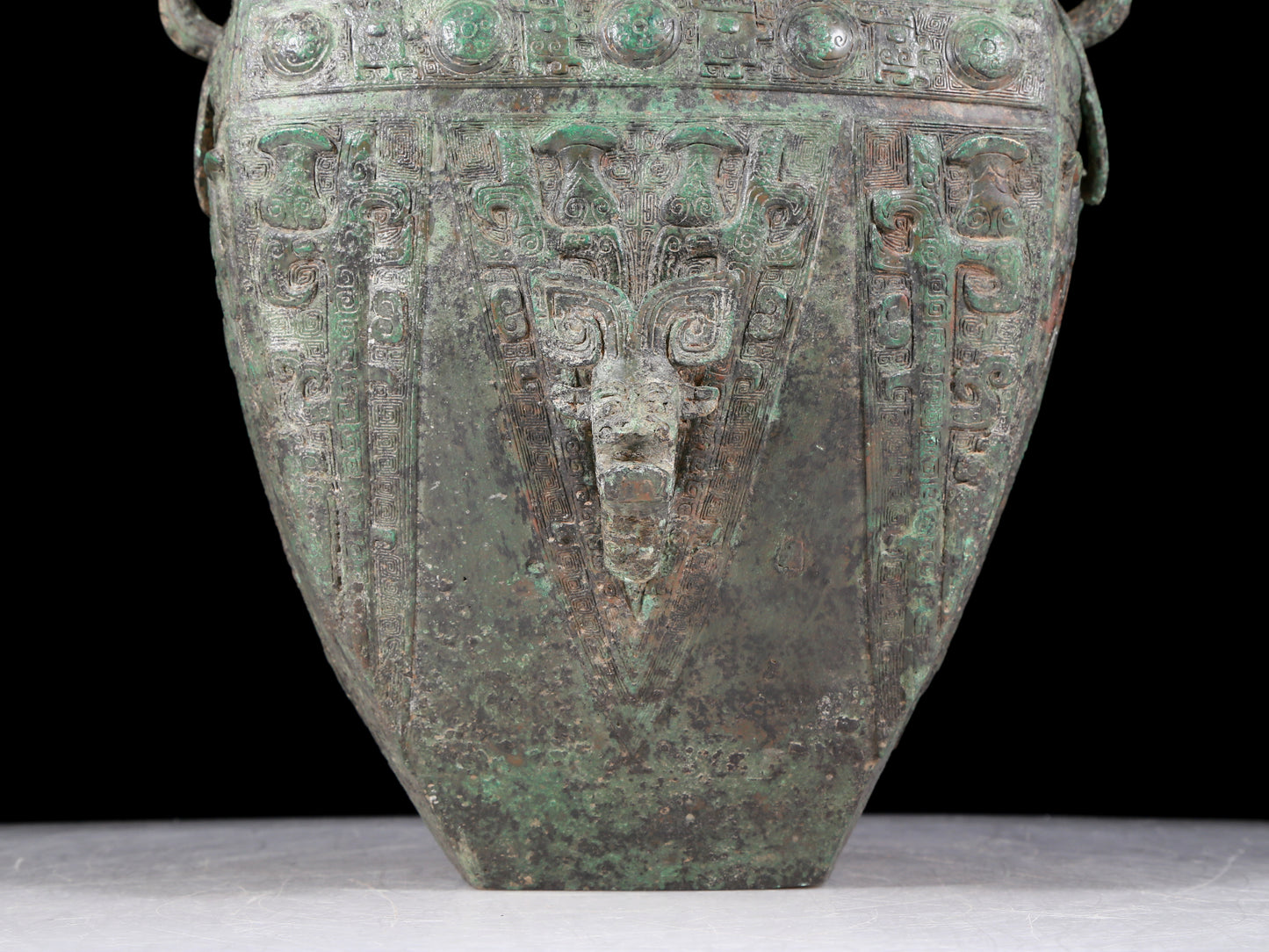 A rare bronze animal-faced amphora with lid