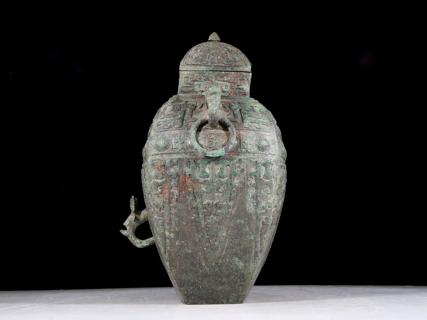 A rare bronze animal-faced amphora with lid