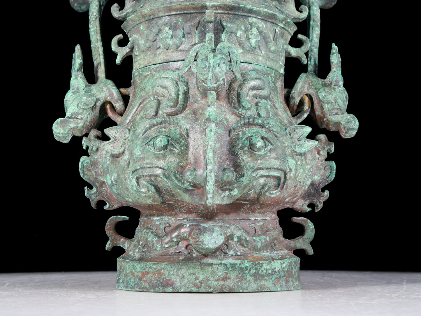 A precious bronze animal-faced pot