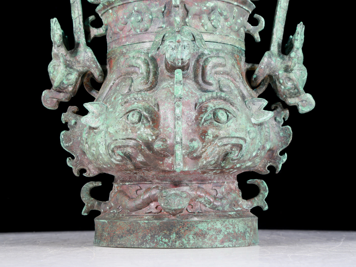 A precious bronze animal-faced pot