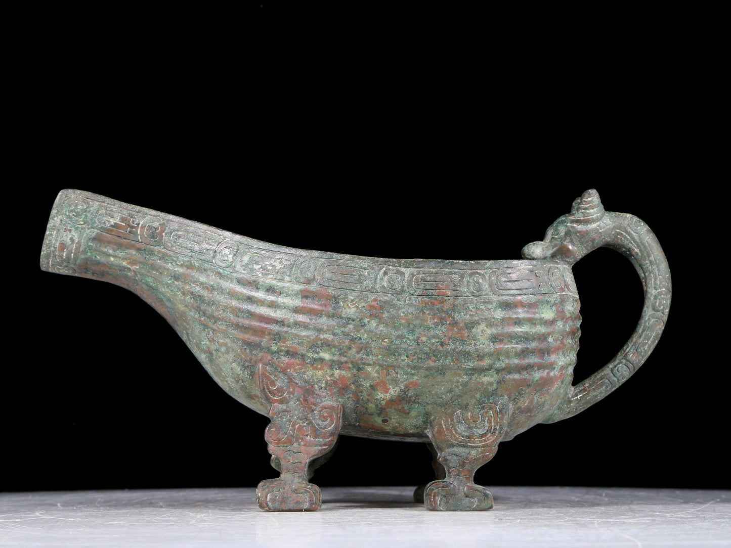 A precious bronze auspicious animal holding pot