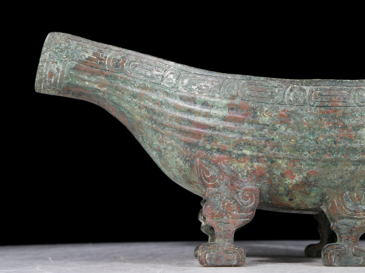 A precious bronze auspicious animal holding pot