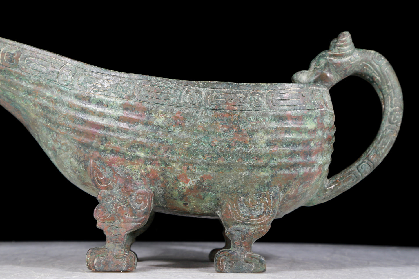 A precious bronze auspicious animal holding pot