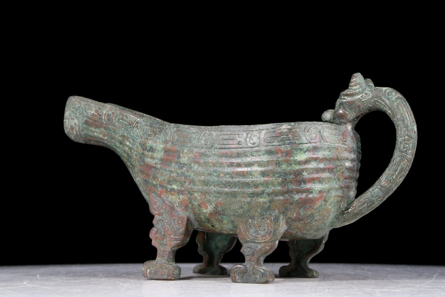 A precious bronze auspicious animal holding pot