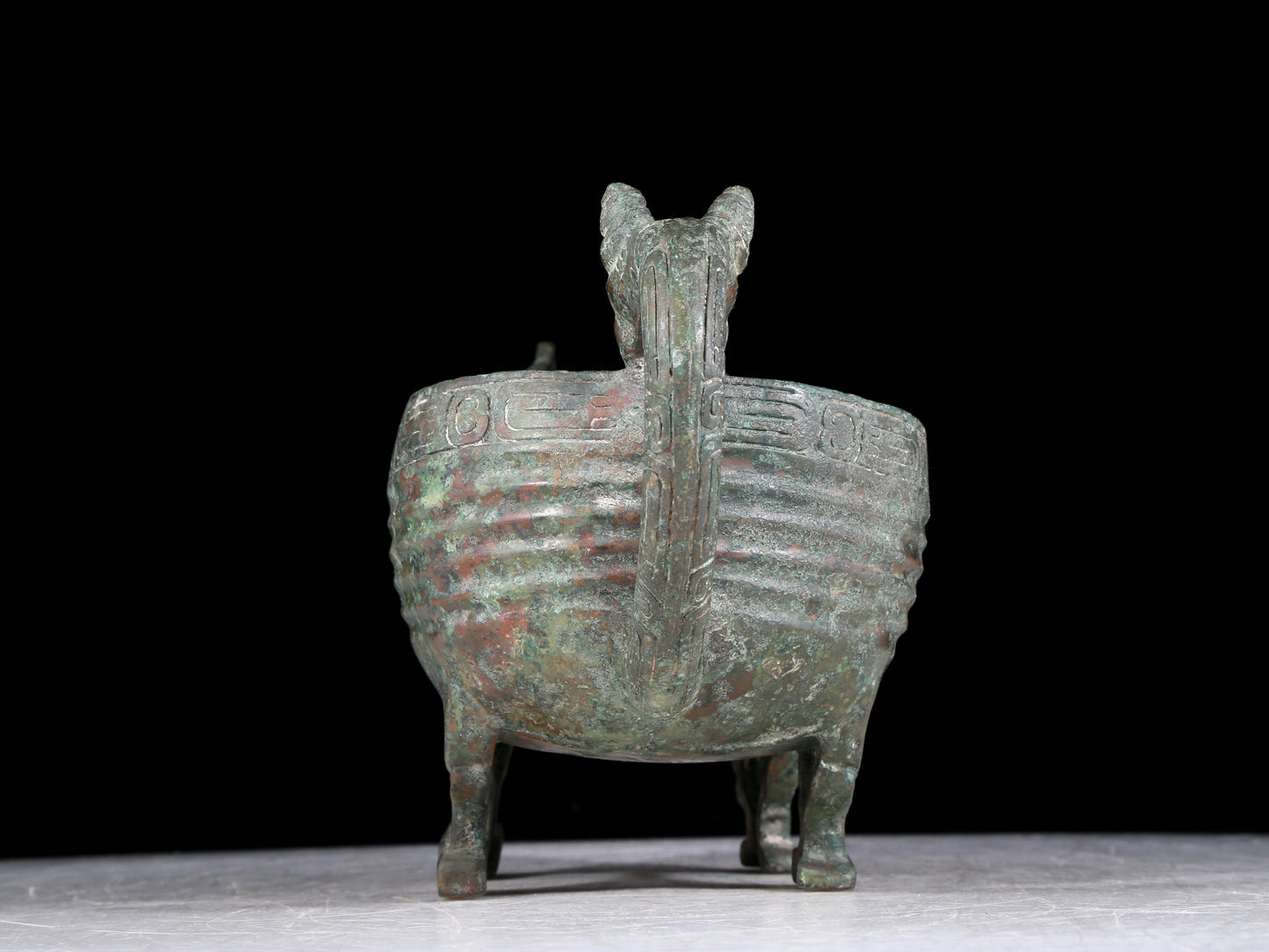 A precious bronze auspicious animal holding pot