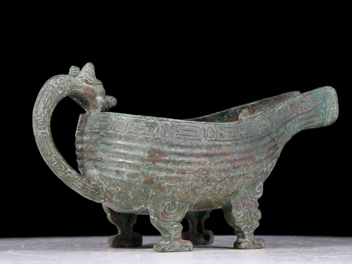 A precious bronze auspicious animal holding pot