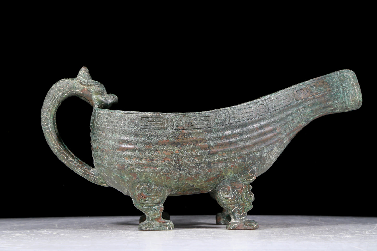 A precious bronze auspicious animal holding pot