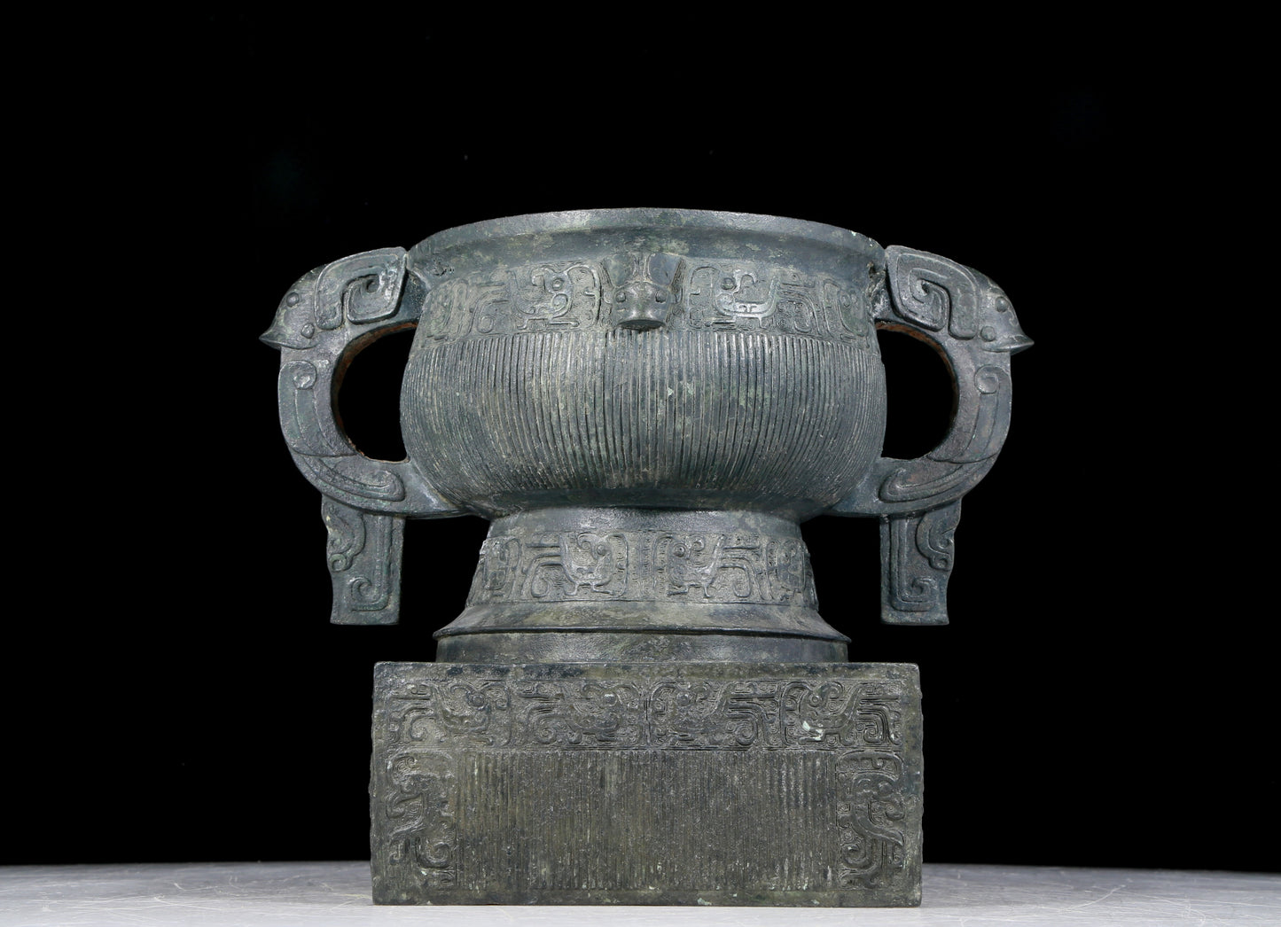 A precious bronze double-eared stove with auspicious animal patterns