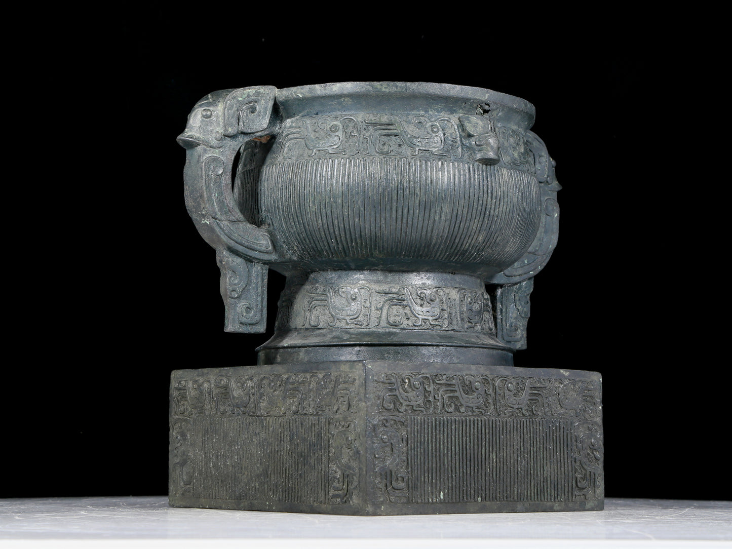 A precious bronze double-eared stove with auspicious animal patterns