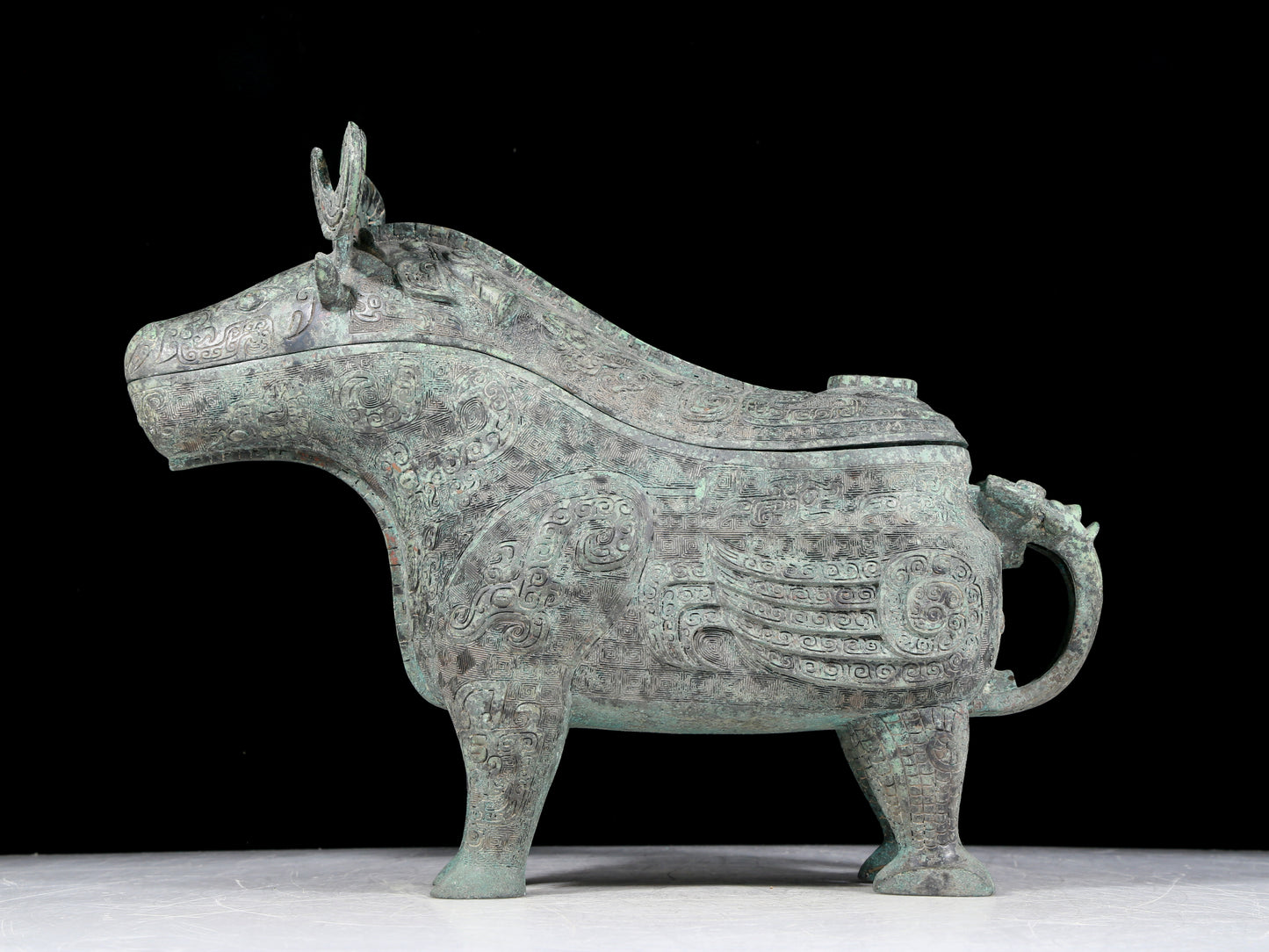 A precious bronze auspicious animal holding pot