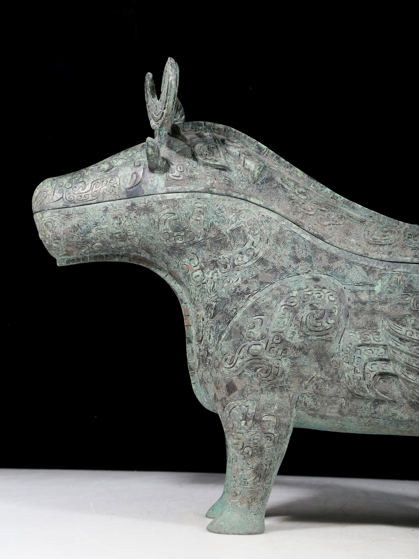 A precious bronze auspicious animal holding pot