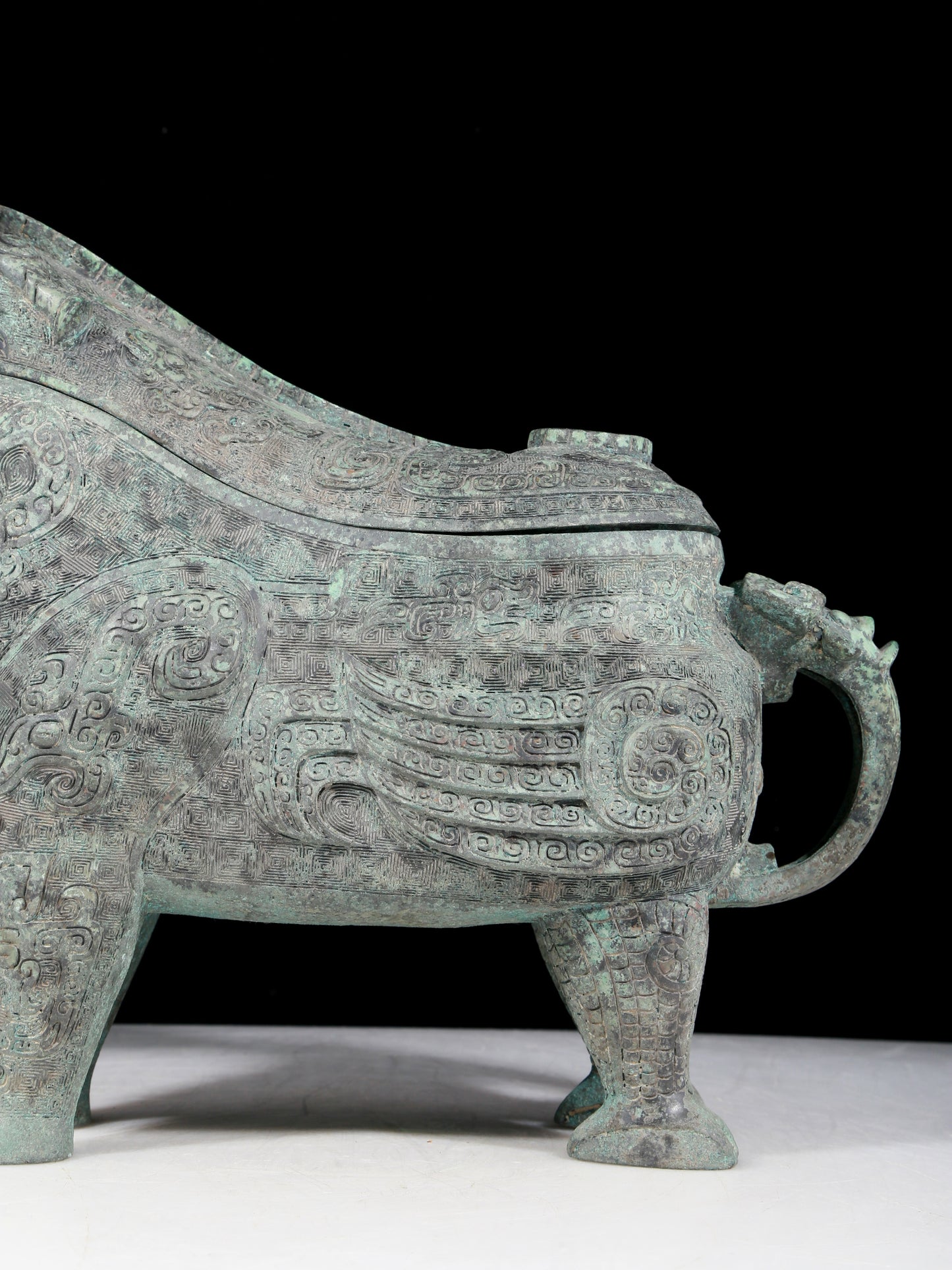 A precious bronze auspicious animal holding pot