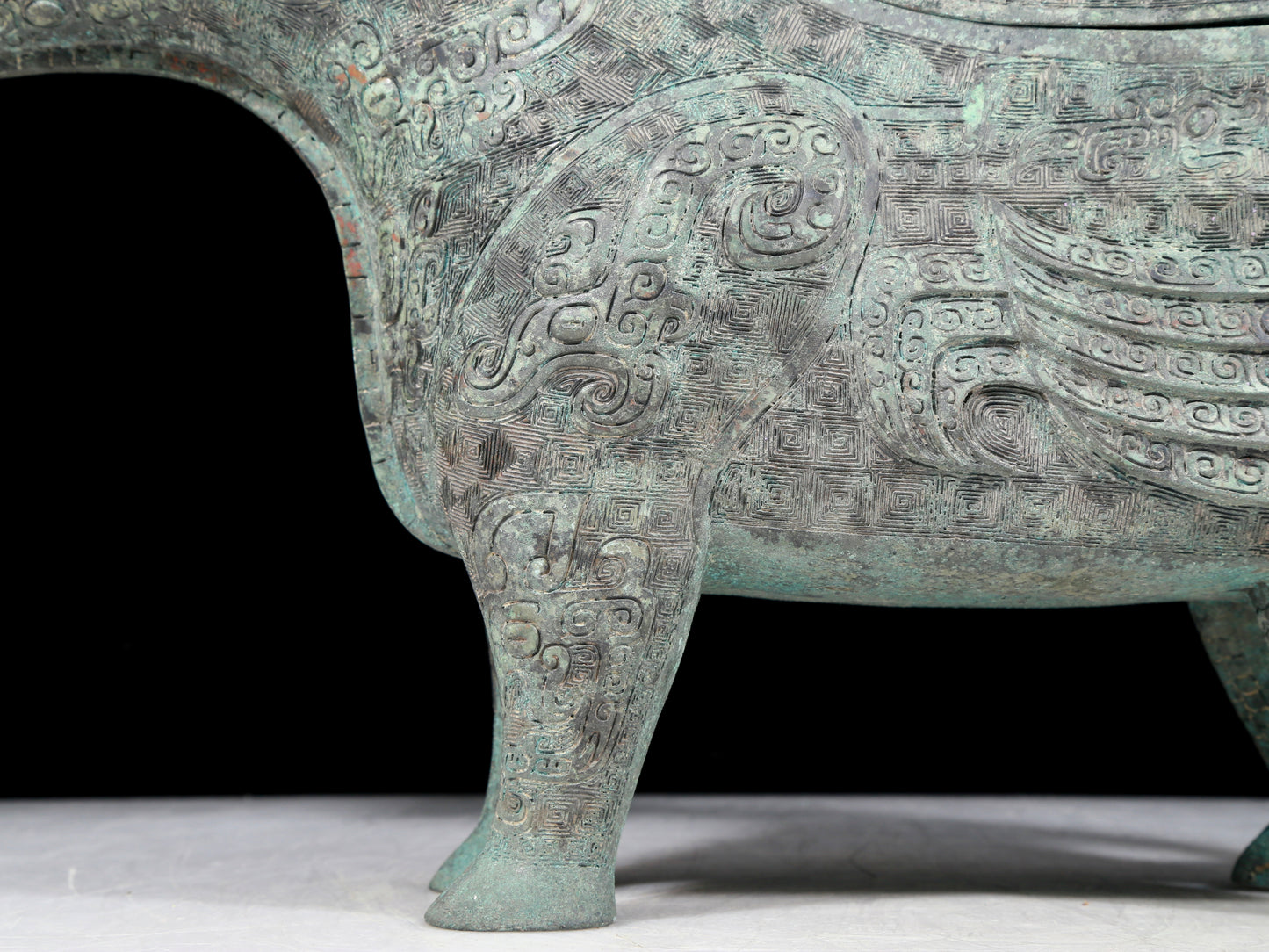 A precious bronze auspicious animal holding pot