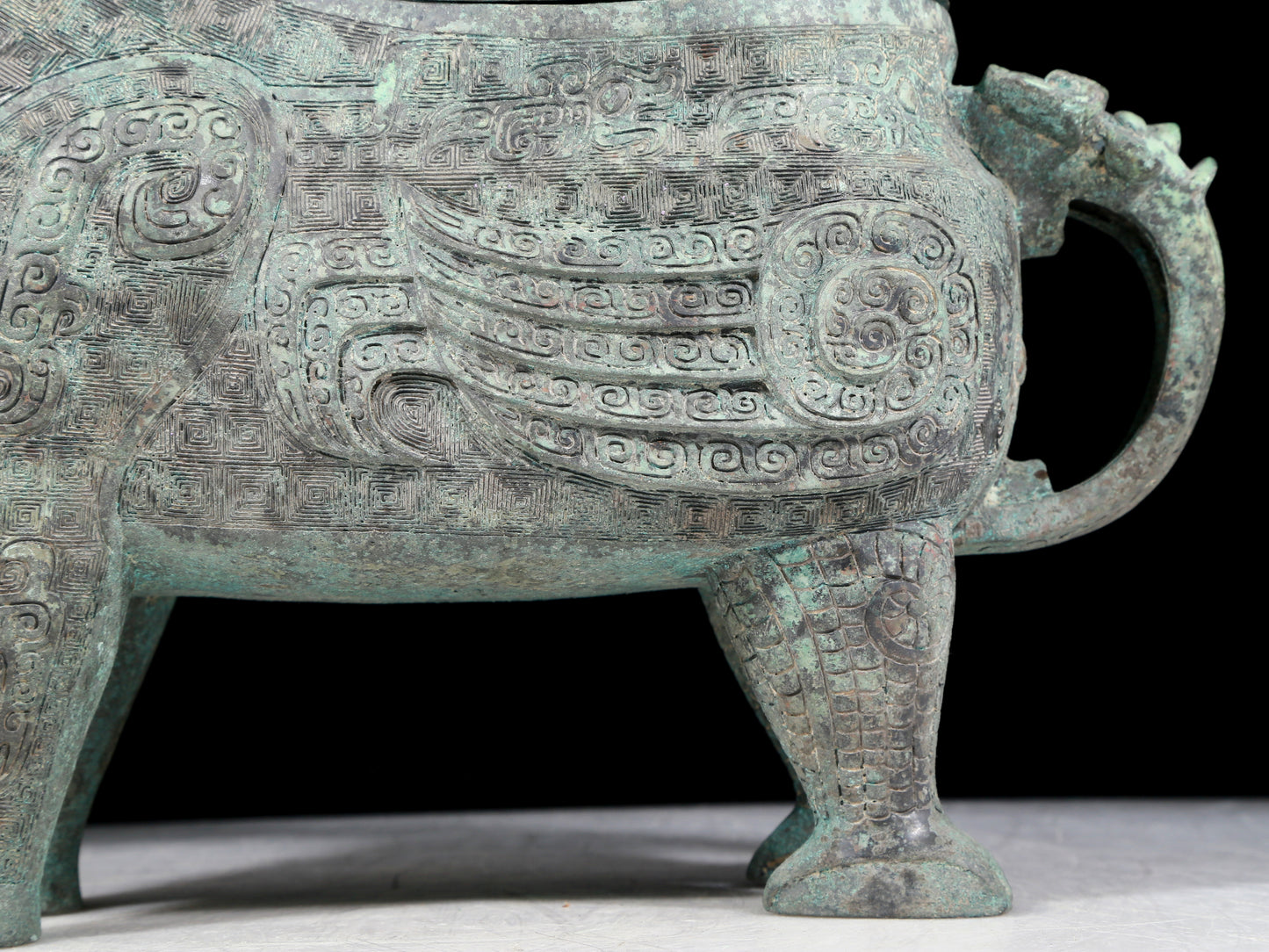 A precious bronze auspicious animal holding pot