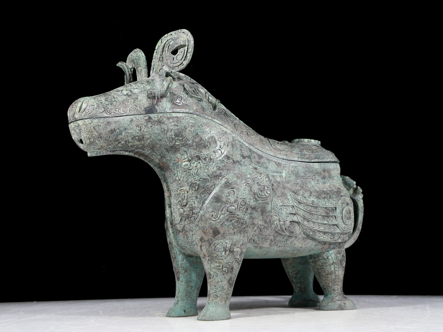 A precious bronze auspicious animal holding pot