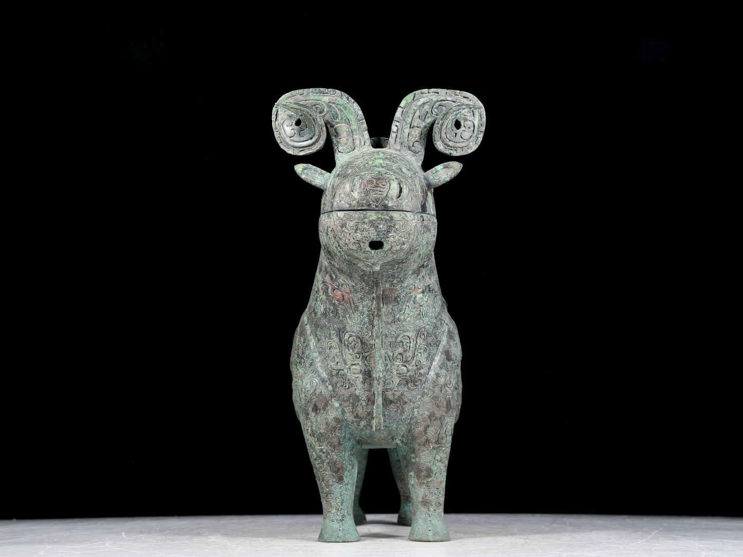 A precious bronze auspicious animal holding pot