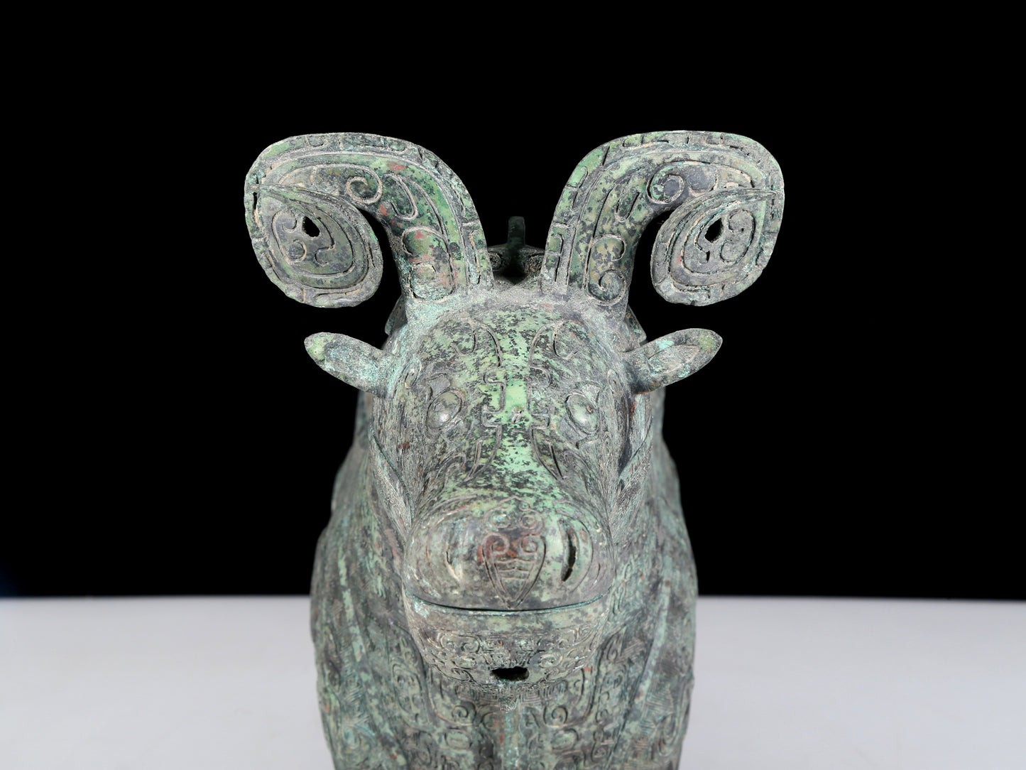 A precious bronze auspicious animal holding pot