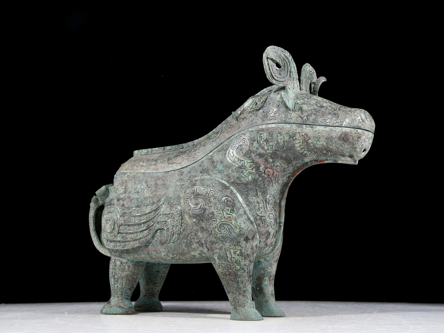 A precious bronze auspicious animal holding pot