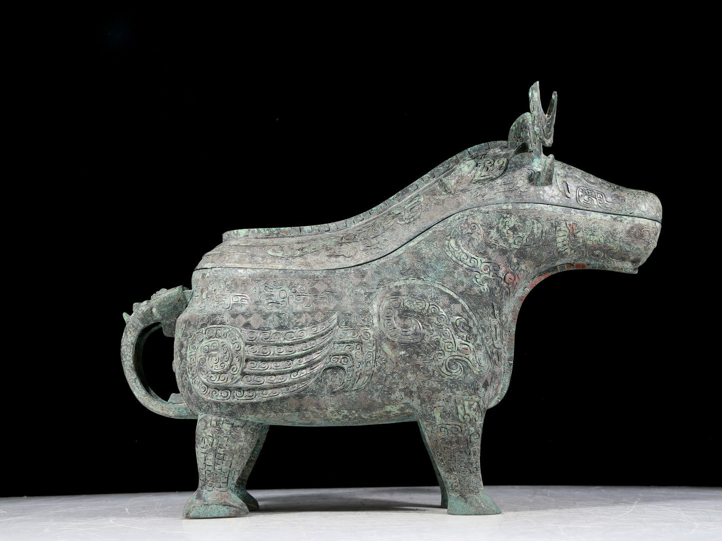 A precious bronze auspicious animal holding pot