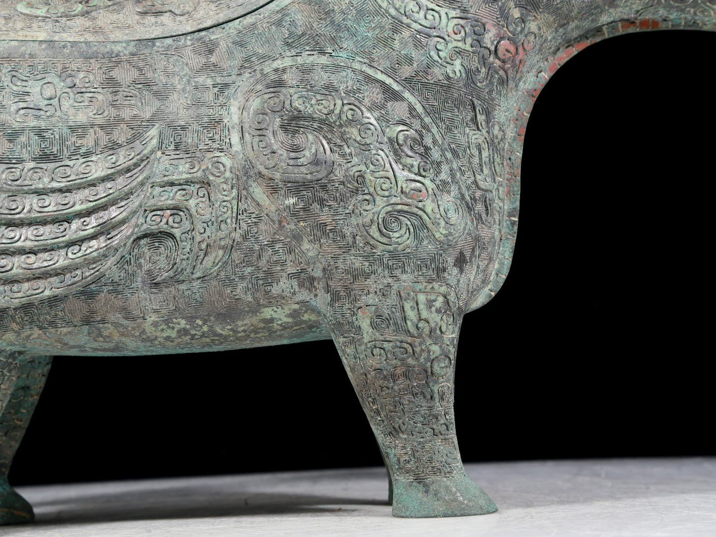 A precious bronze auspicious animal holding pot