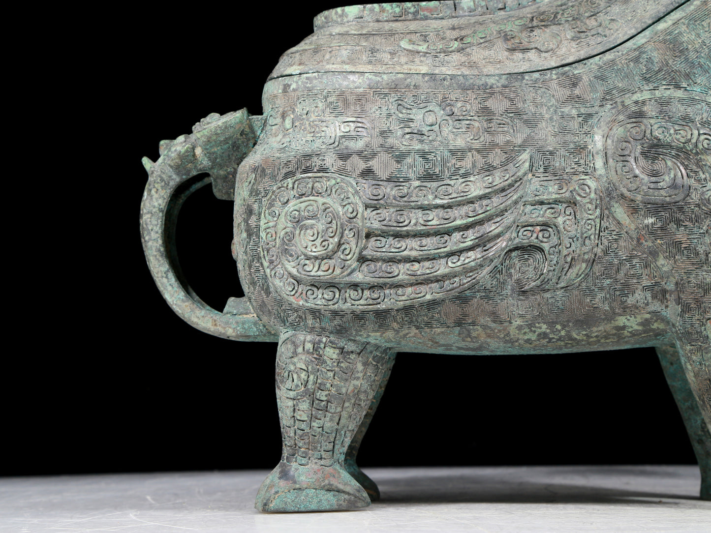 A precious bronze auspicious animal holding pot