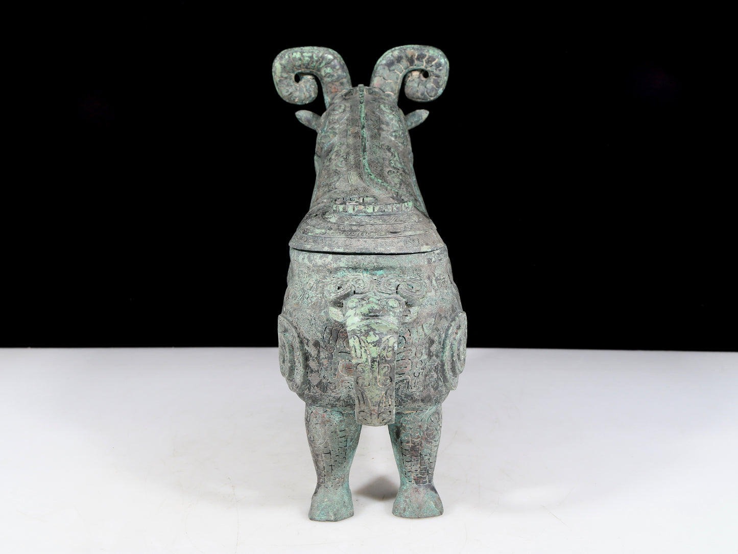 A precious bronze auspicious animal holding pot