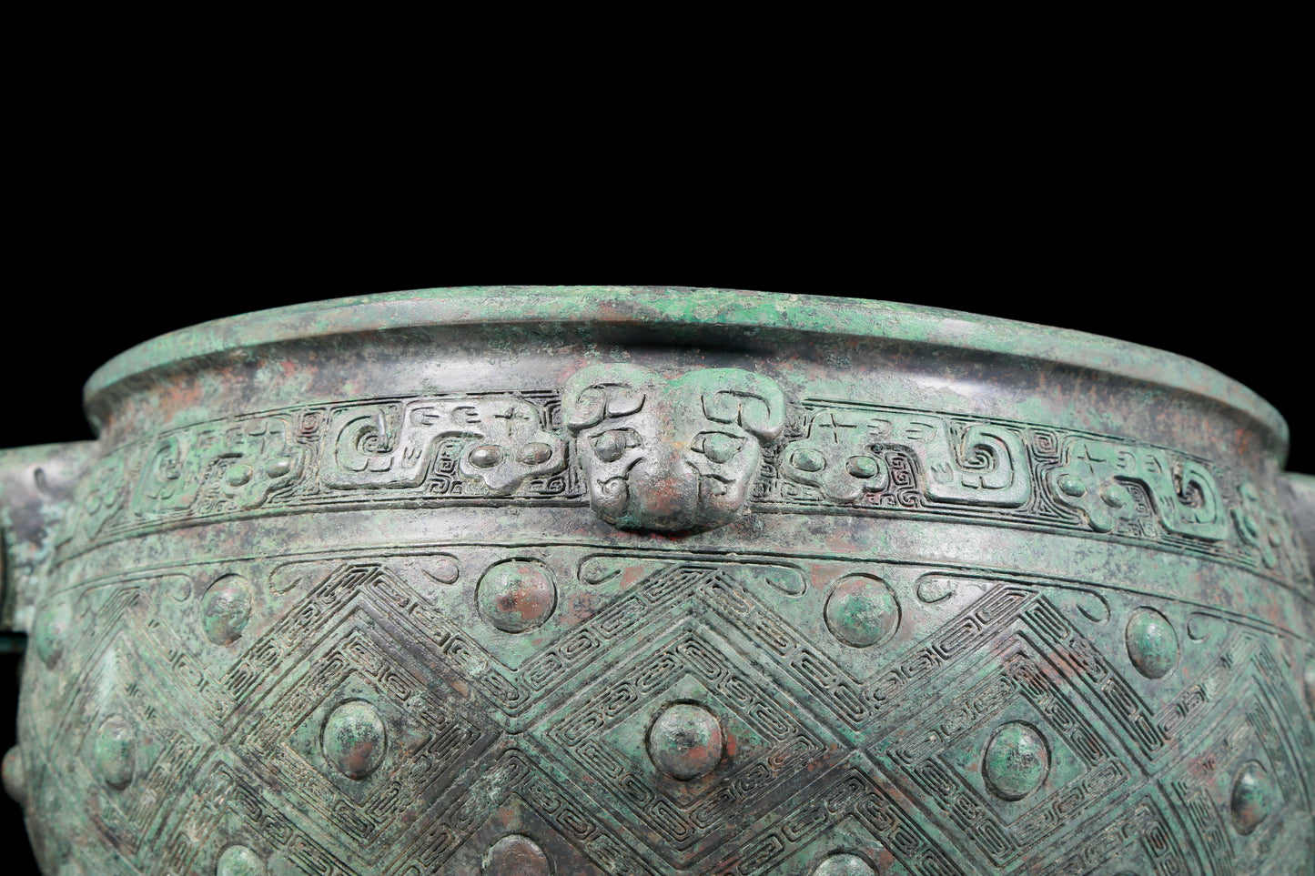 A rare bronze animal-mask elephant-ear censer