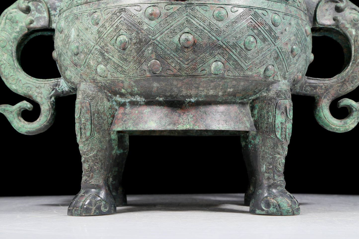 A rare bronze animal-mask elephant-ear censer