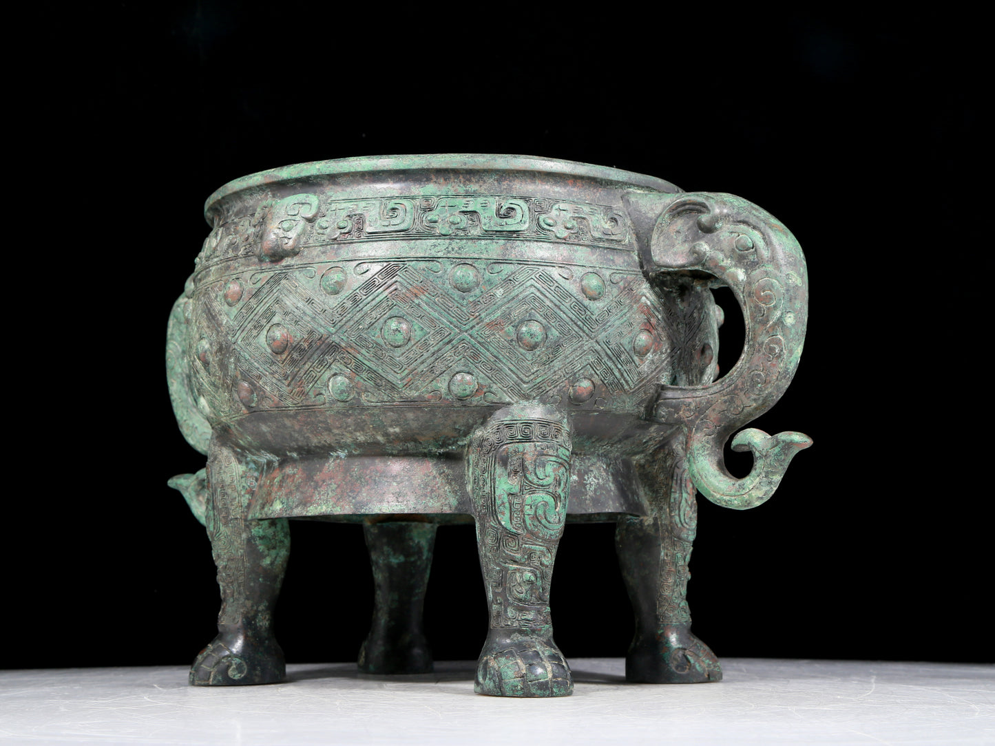 A rare bronze animal-mask elephant-ear censer