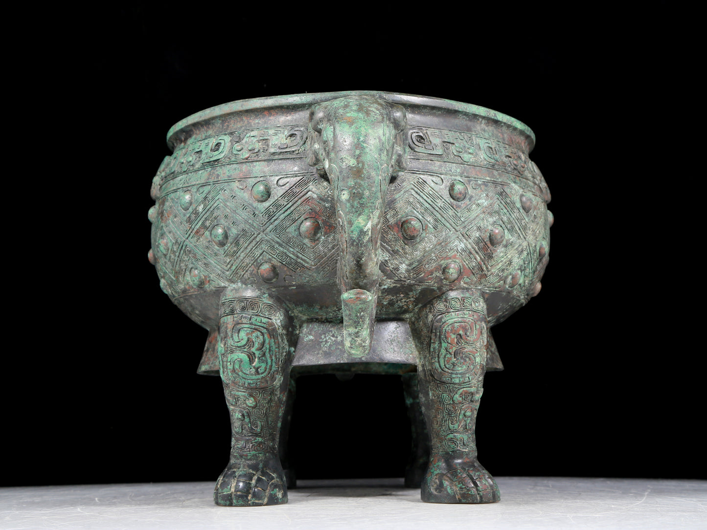 A rare bronze animal-mask elephant-ear censer