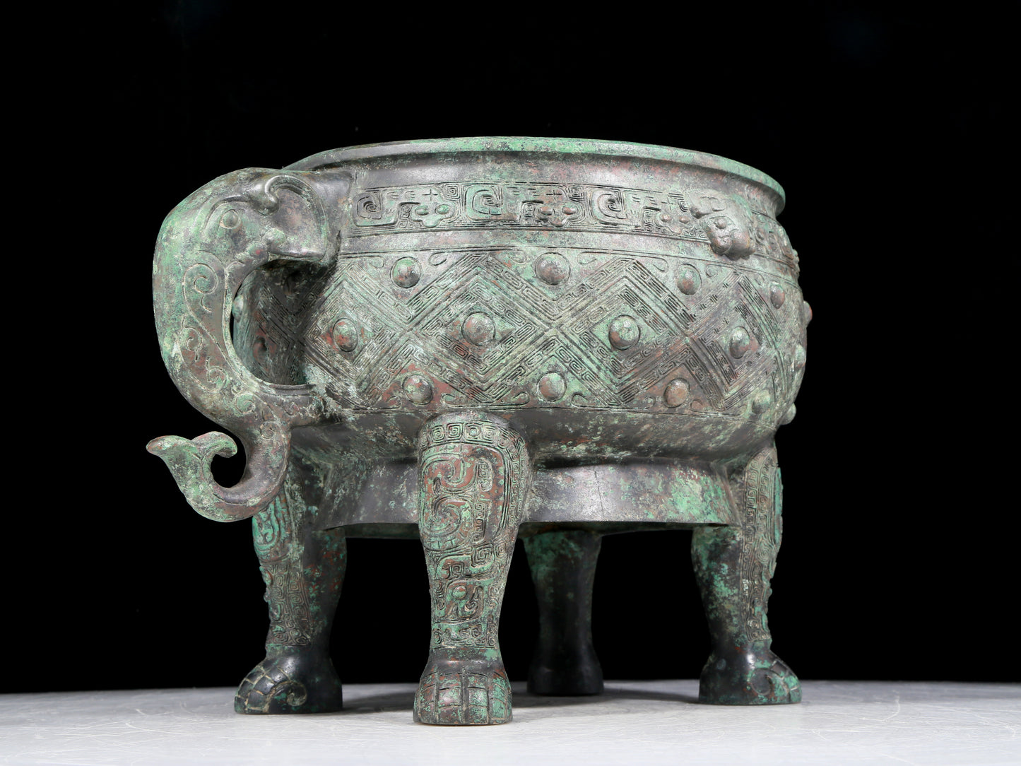 A rare bronze animal-mask elephant-ear censer