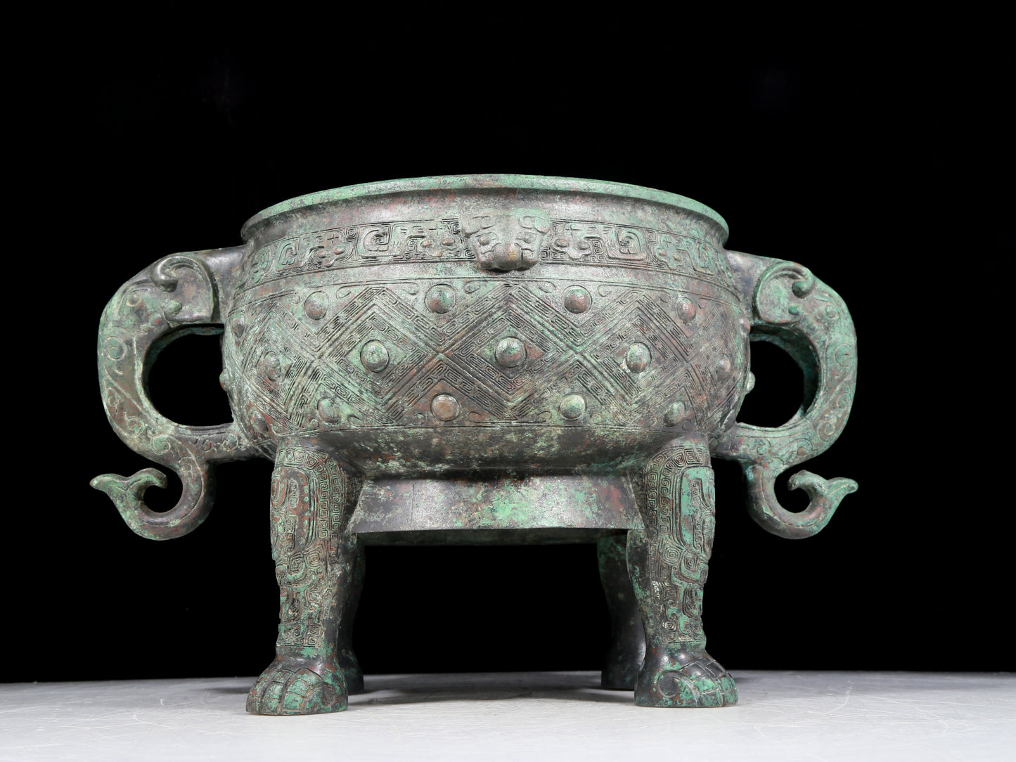 A rare bronze animal-mask elephant-ear censer