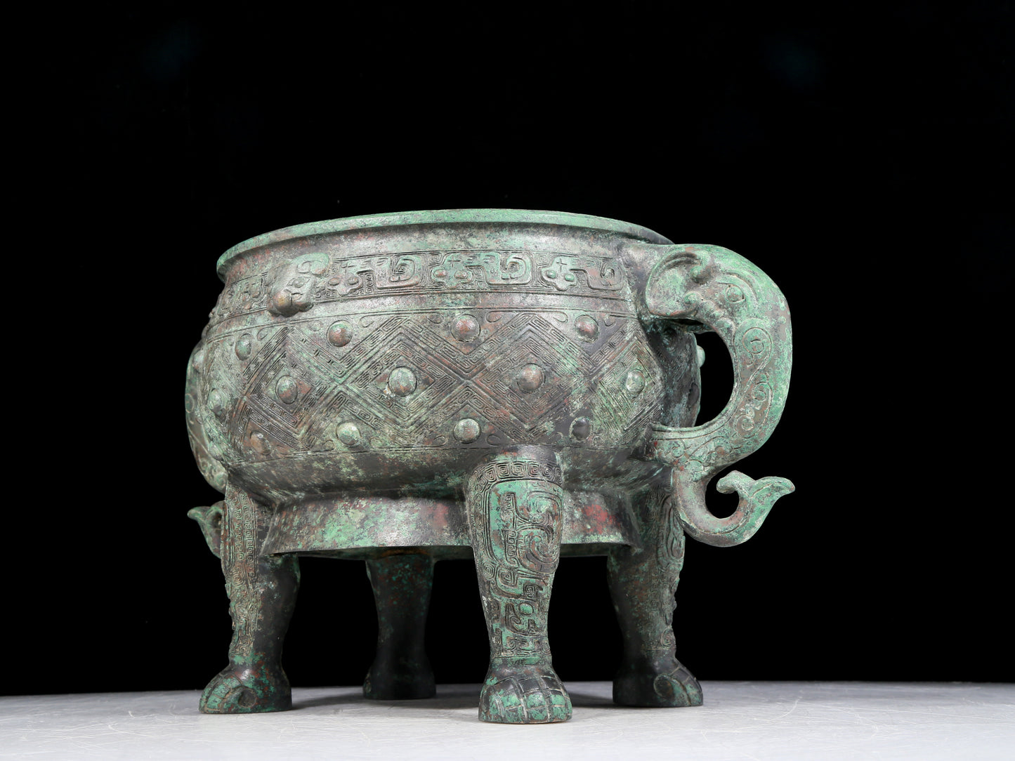 A rare bronze animal-mask elephant-ear censer