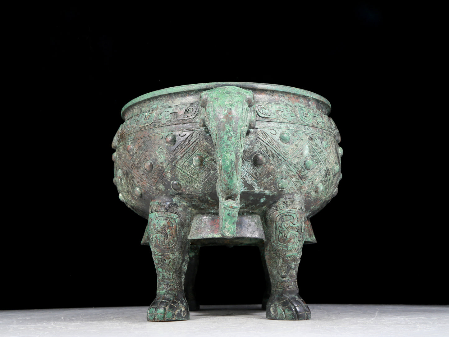 A rare bronze animal-mask elephant-ear censer