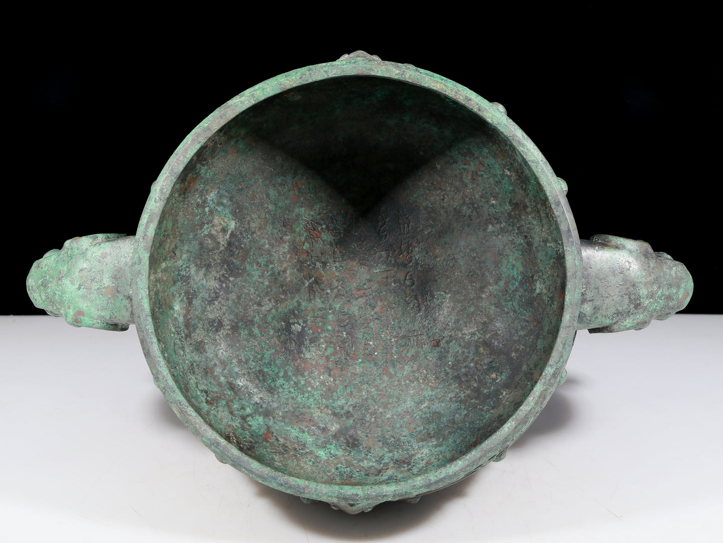 A rare bronze animal-mask elephant-ear censer